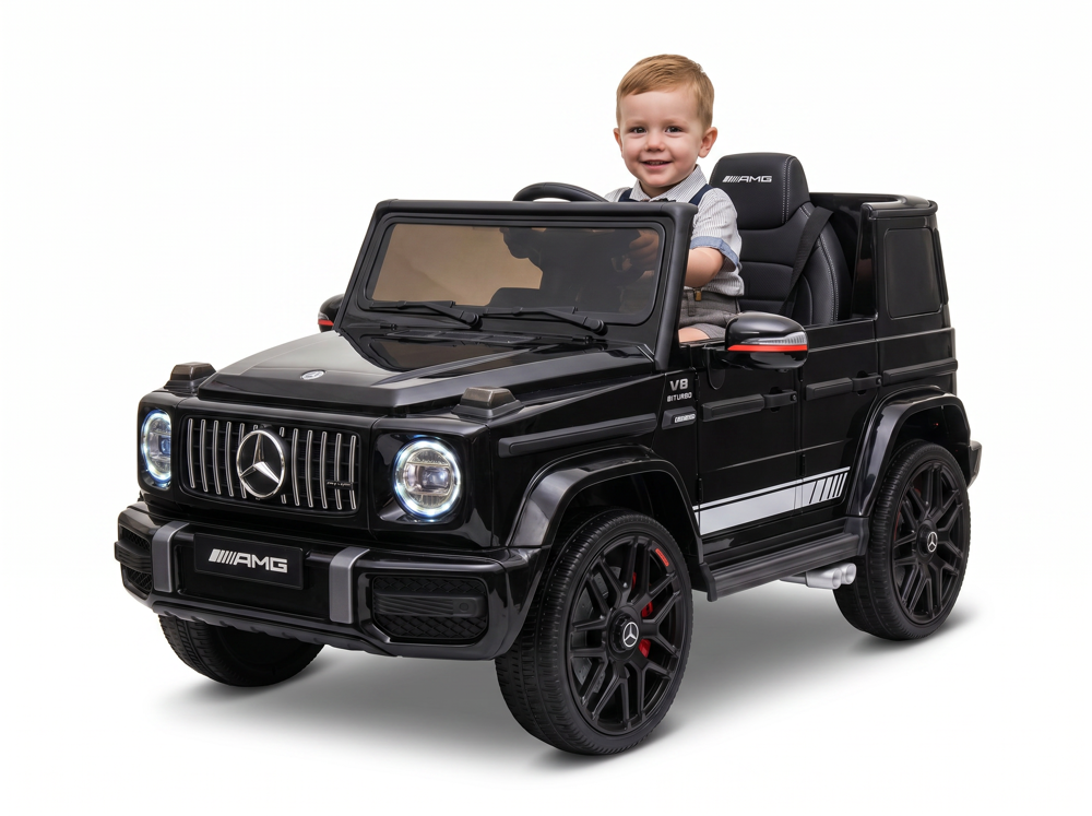 Mercedes G63 AMG enfant 12V — détail pneus caoutchouc sur gazon